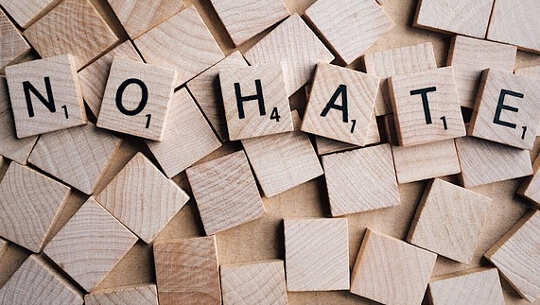 Scrabble letters that spell out: NO HATE