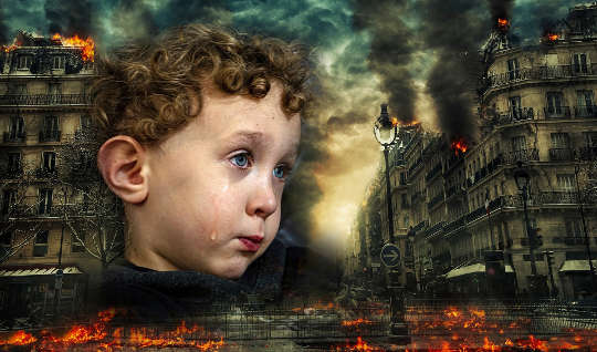 a crying child in the face of war, destruction, and chaos