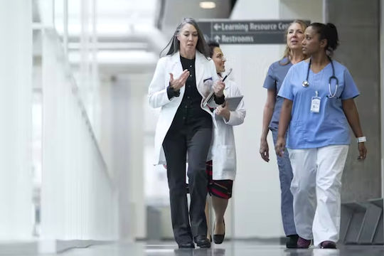 medical professionals in a hallway