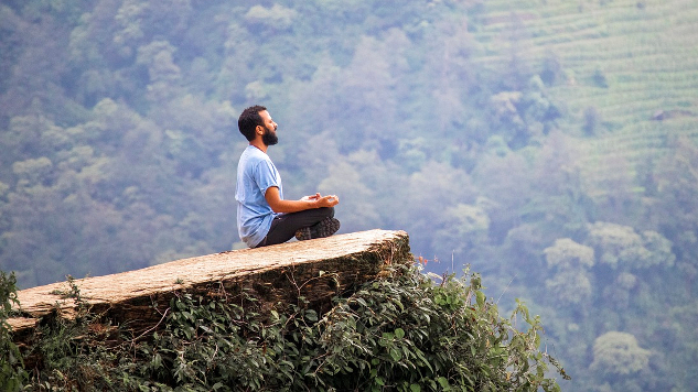 man sitting in meditation 