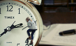 a woman climbing on a clock