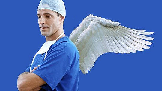 a doctor in scrubs with angel wings