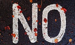 the word "NO" written on the pavement