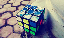 rubik's cube with artistic drawings on the top