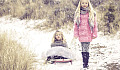 two siblings in the snow