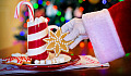 Santa Claus, a candy cane, a candle, and a cookie... Christmas traditions
