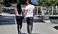 a couple walking hand in hand