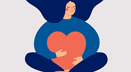 an overweight woman sitting down holding a big heart in her lap