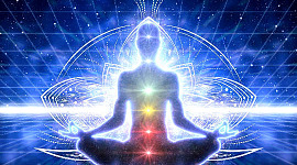 a person in meditation with lit up chakras and energy lines around the body